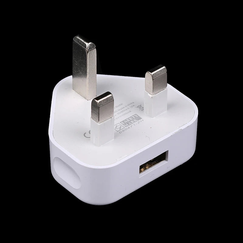 White plug adapter with USB port on a black background