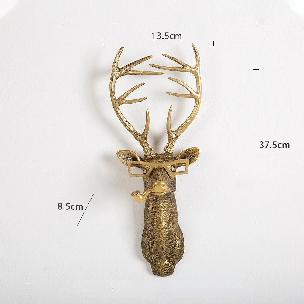 Gold deer head wall hook with dimensions on a white background