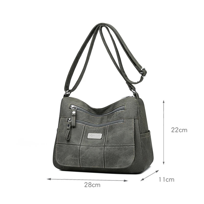 Gray shoulder bag with dimensions on a white background