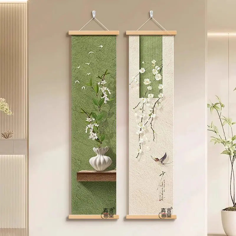 Two vertical wall art pieces with floral designs on a neutral wall.