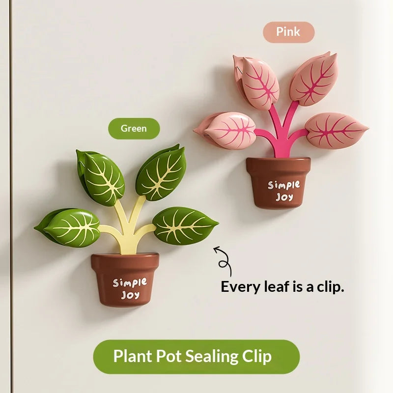 Two plant pot sealing clips, one green and one pink, on a white background.
