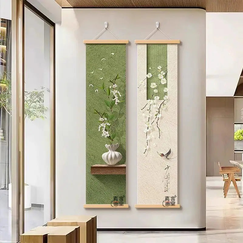 Two vertical wall hangings with floral designs on a white wall.