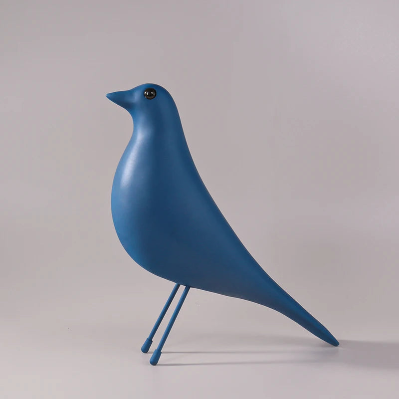 Blue bird-shaped object on a gray background
