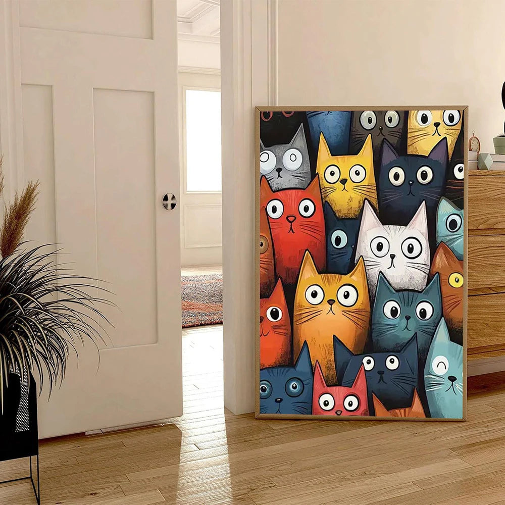 Decorative mirror with colorful cat faces on a wooden floor.