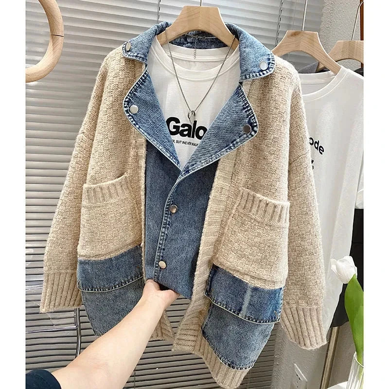 Beige and blue denim jacket on a hanger with a white shirt underneath.