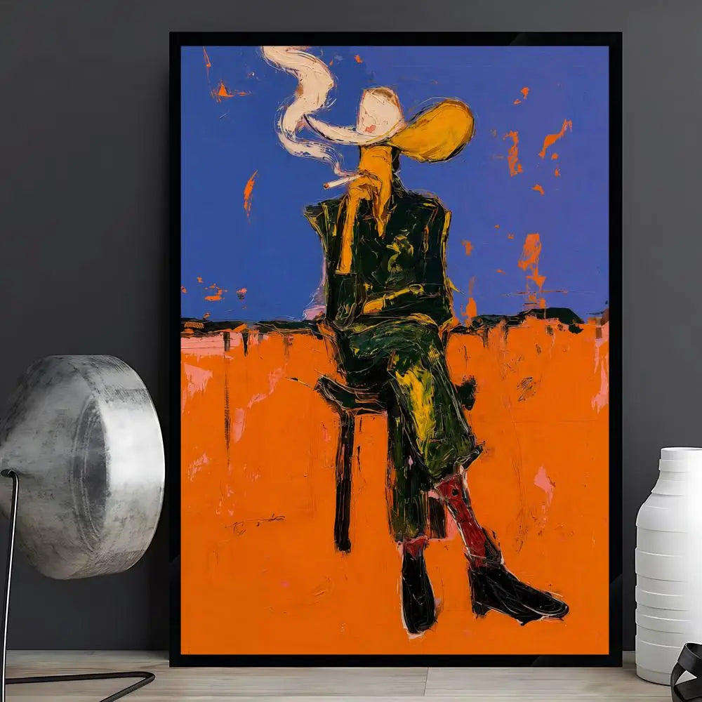 A framed abstract art print depicting a seated figure with a smoking pipe, set against a blue and orange background, displayed on a shelf between a silver lamp and a white vase.