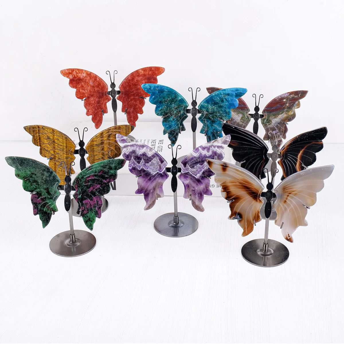 natural amethyst crystal butterfly carving ornament with gemstone wings on metal display stand