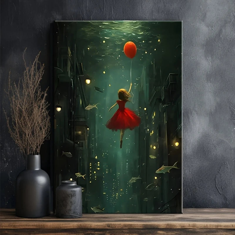 Framed artwork of a girl in a red dress floating underwater with a balloon, displayed on a wooden shelf.
