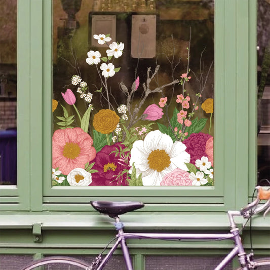 floral window cling sticker on glass showing colourful stained glass effect with flowers and sunlight
