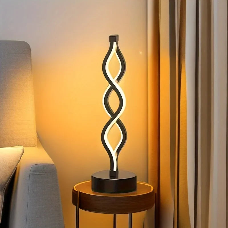 Modern table lamp with a spiral design on a side table next to a sofa.