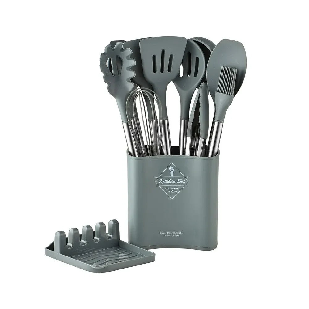 Set of kitchen utensils in a gray holder on a white background