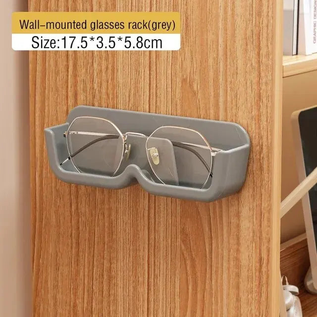 Wall-mounted glasses rack on a wooden wall with size information displayed.