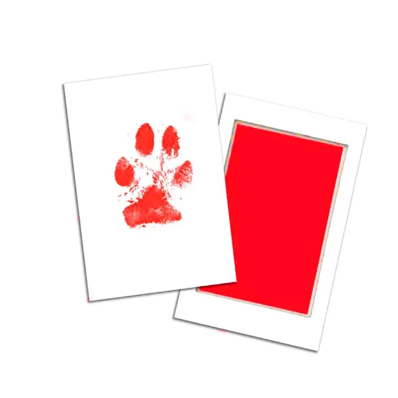 Two white cards with red paw print on one card and a red square on the other, on a white background.