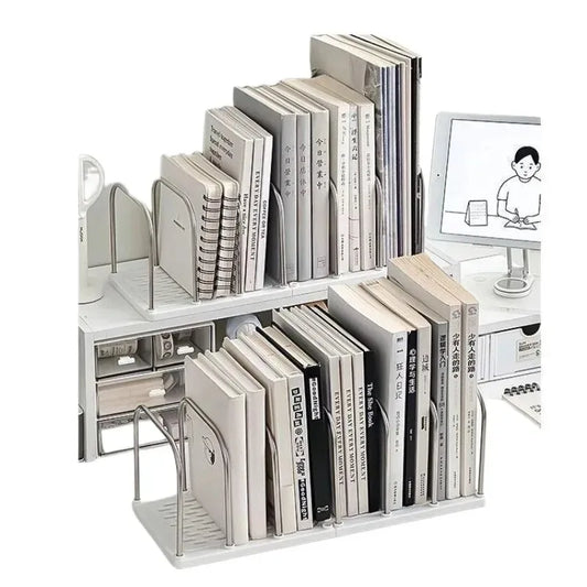 White bookshelf stand with books and a small TV displaying a cartoon character.