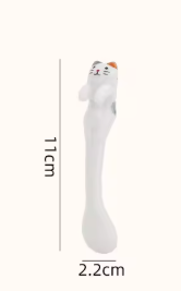 Green and yellow ceramic cat mugs with a 3D cat climbing over the rim.