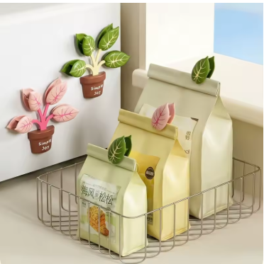 Cute plant-shaped magnetic food sealing clips displayed as decorative kitchen fridge magnets for sealing snack and food bags.