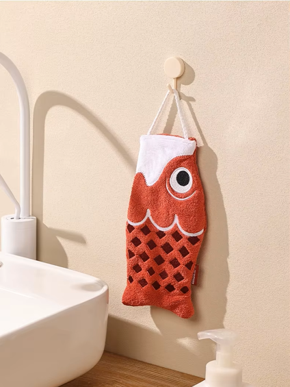 Cute Koi Fish shaped hand towel hanging on a hook in red 