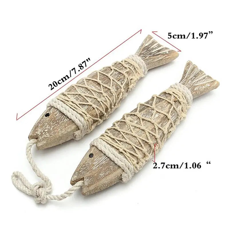 Two wooden fish-shaped objects with rope, showing measurements on a white background.