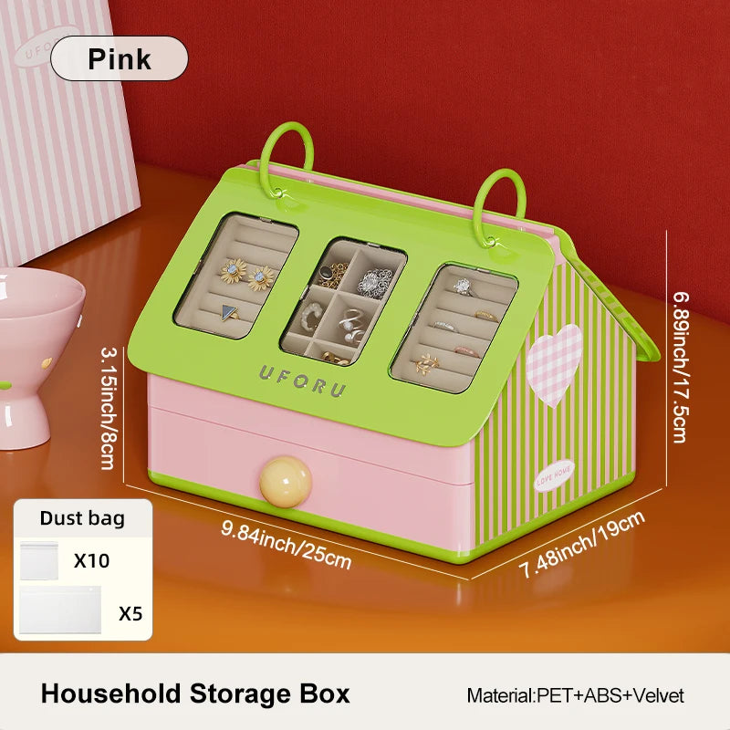 Green and pink jewelry storage box with measurements on a wooden surface