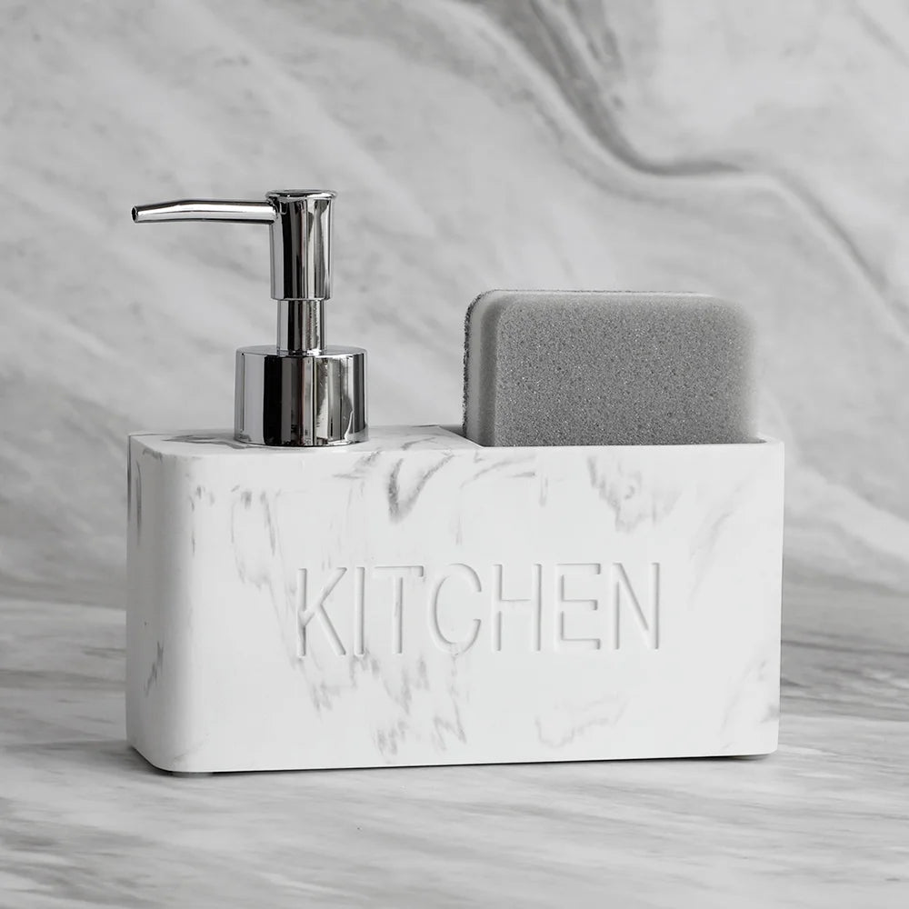 Marble-textured kitchen sink caddy with soap dispenser and sponge on a marble background