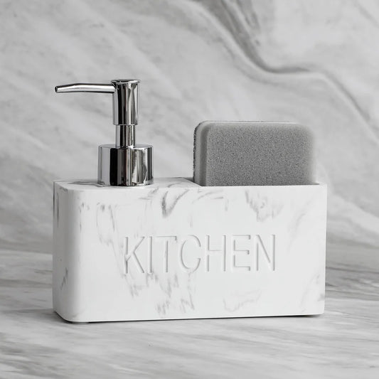 Marble-textured kitchen sink caddy with soap dispenser and sponge on a marble background