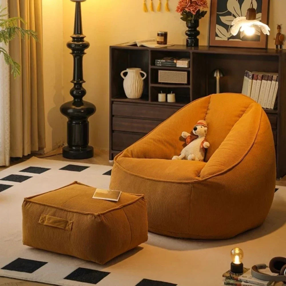 Orange bean bag chair with a white plush toy in a cozy living room setting.
