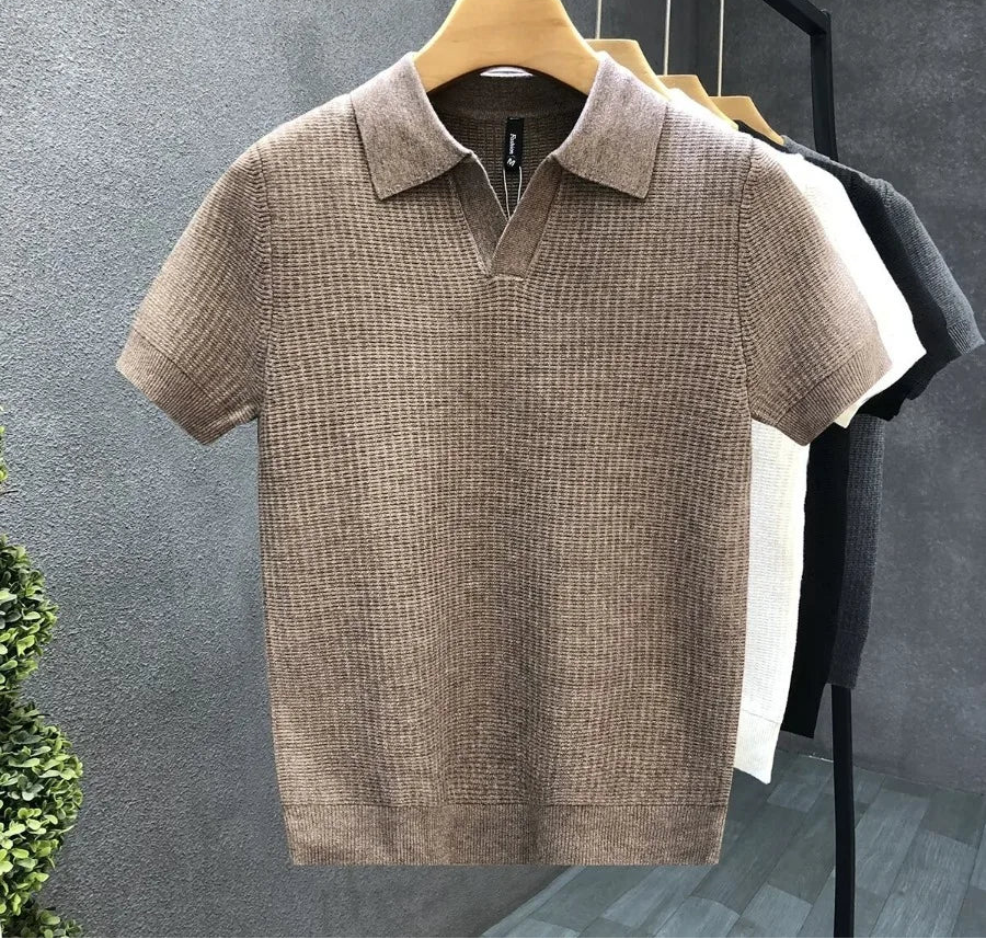 Brown textured polo shirt on a hanger against a gray background