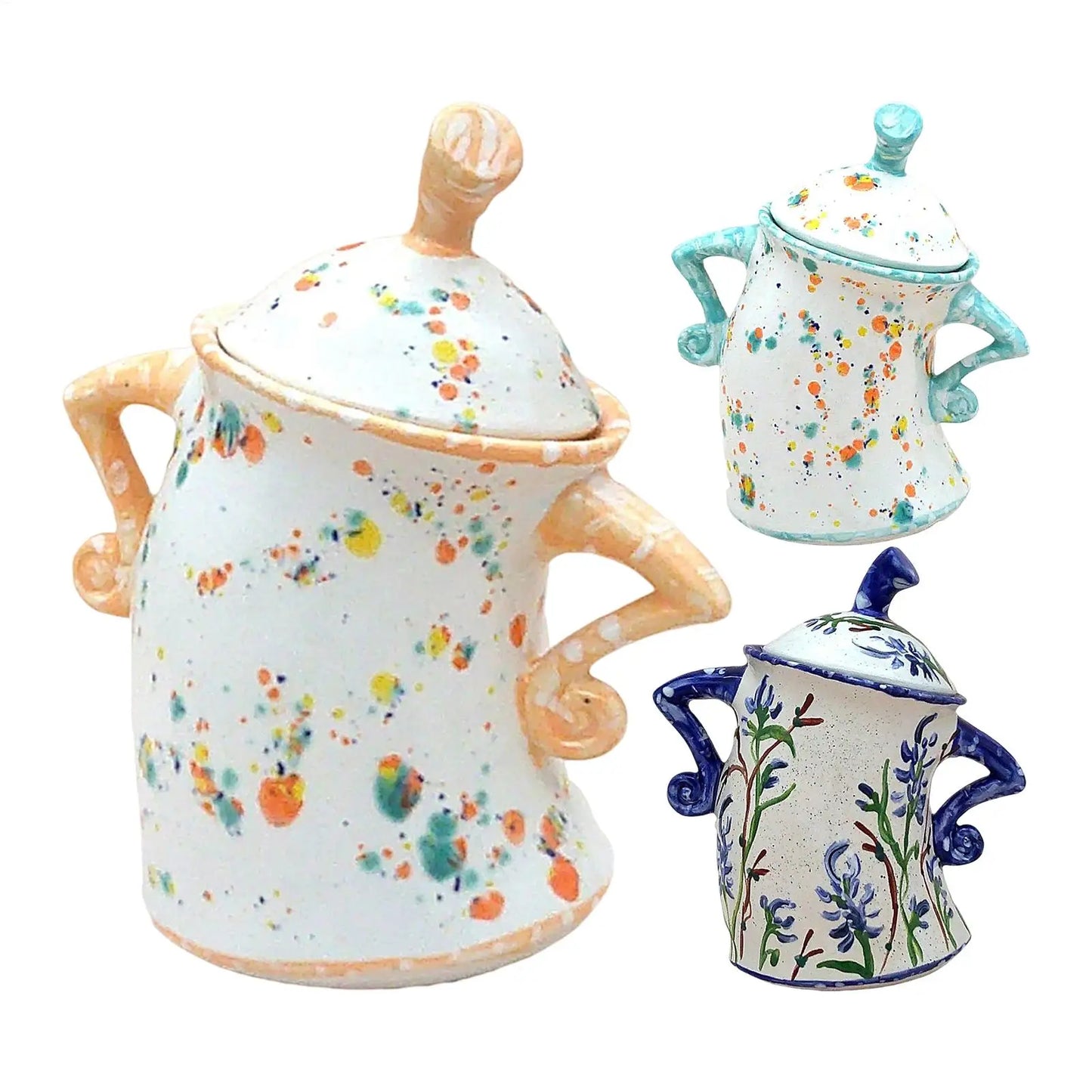 Three ceramic pots with floral patterns on a white background