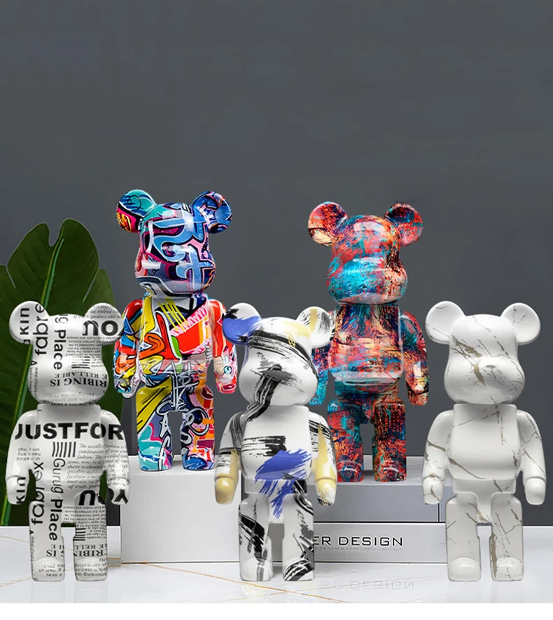 Collection of colorful and white bear-like figurines on a dark background
