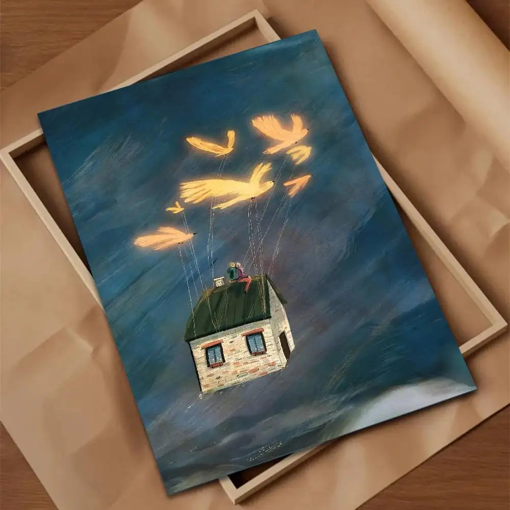 Painting of a house being lifted by birds against a blue sky, displayed in a wooden frame.