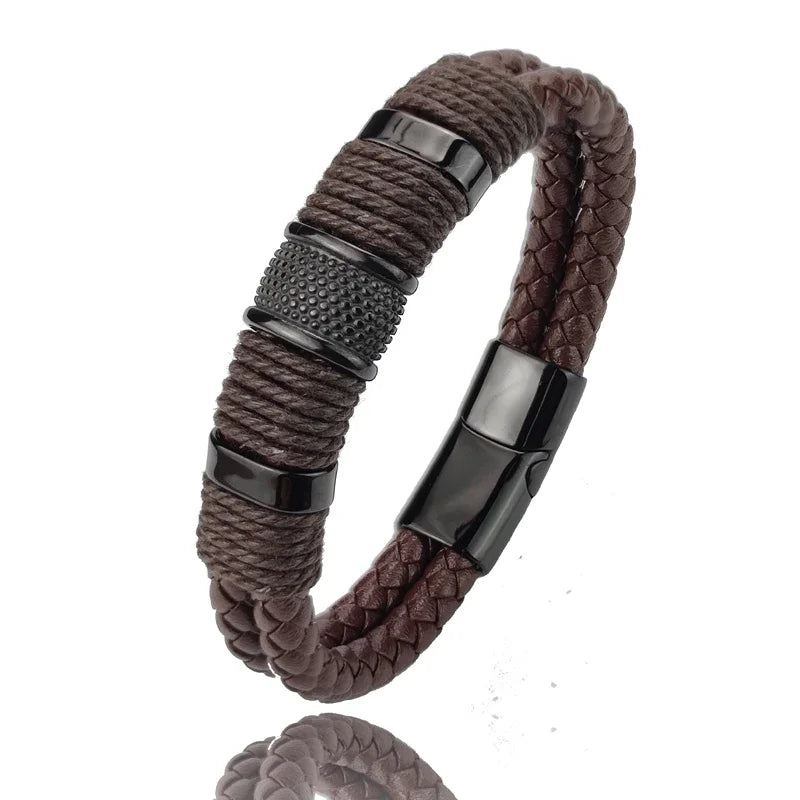 Brown braided bracelet with black metal clasp on a white background