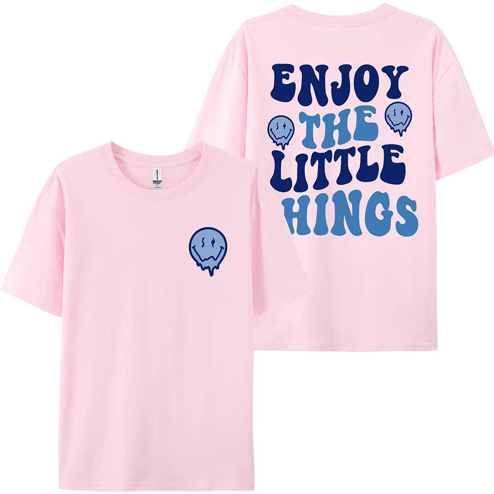 Pink t-shirt with blue text and graphics on a white background