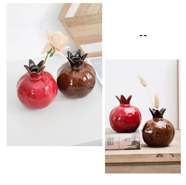 Two ceramic vases shaped like pomegranates on a white background.