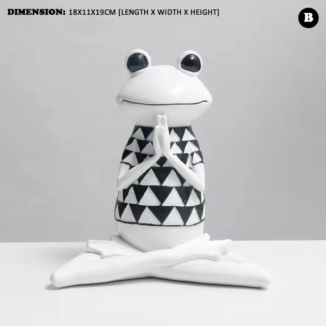 Frog-shaped decorative item with a black and white pattern on a gray background