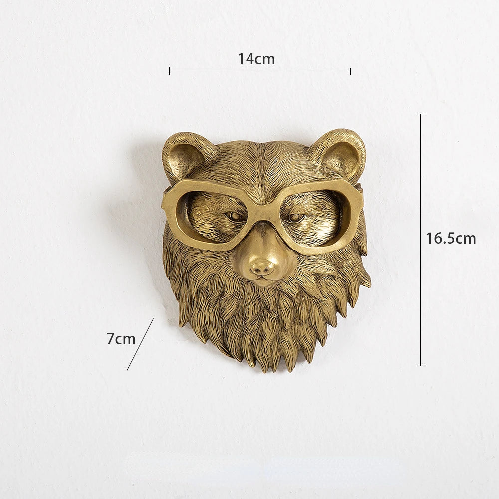 Gold bear head wall decoration with sunglasses and measurements on a white background