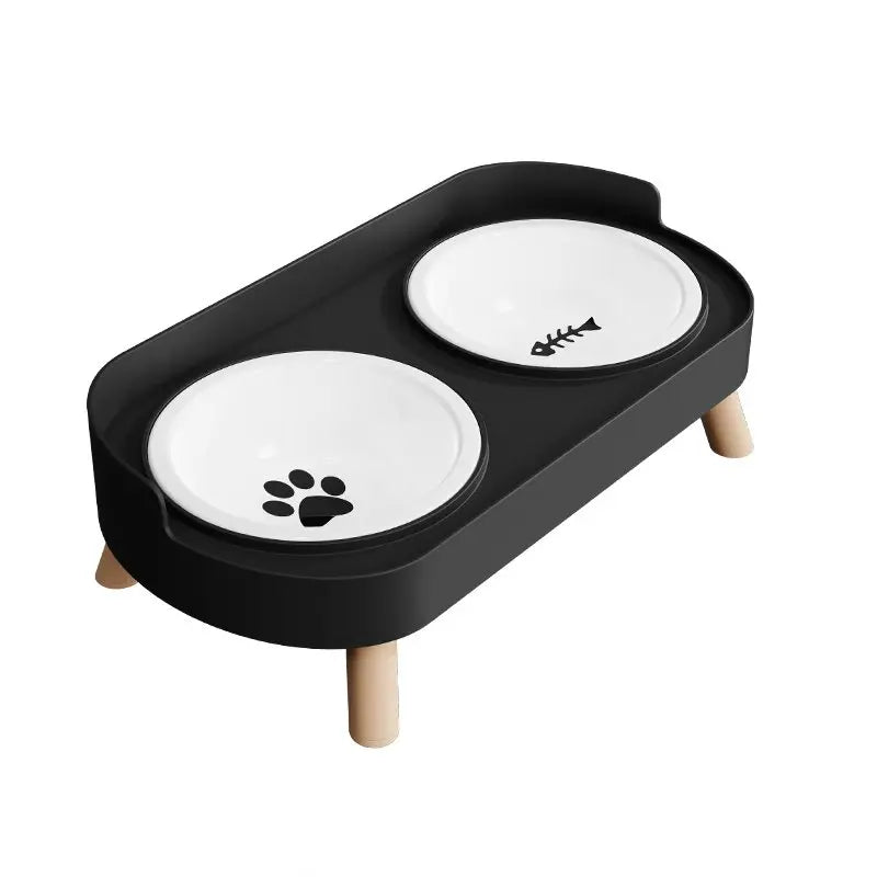 Black pet feeder with two white bowls on a white background