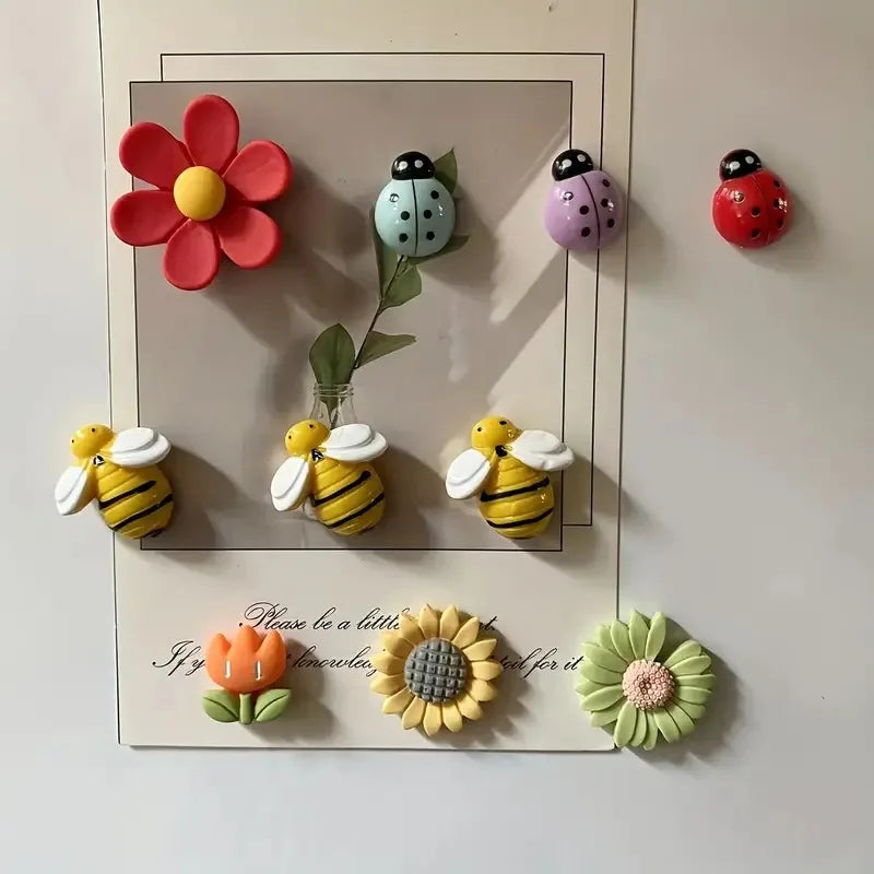 Set of colorful resin flowers and insect magnets  on a white background
