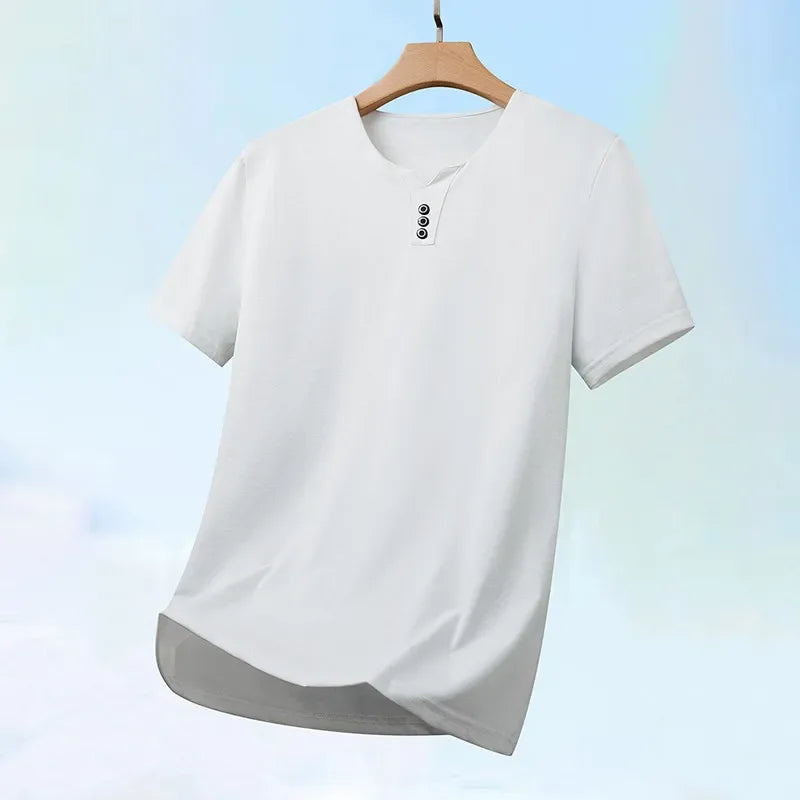 White shirt on a wooden hanger with a light blue gradient background