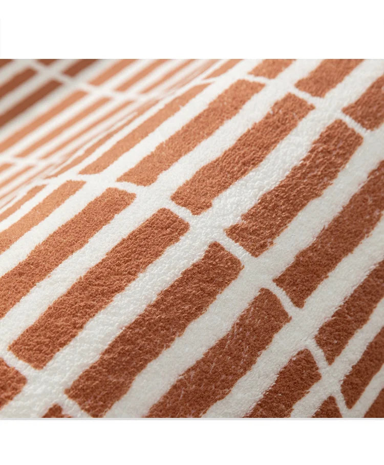 Close-up of a textured fabric with a geometric pattern on a white background