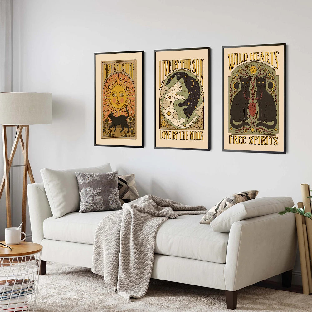 Living room with a sofa and three framed posters on the wall.