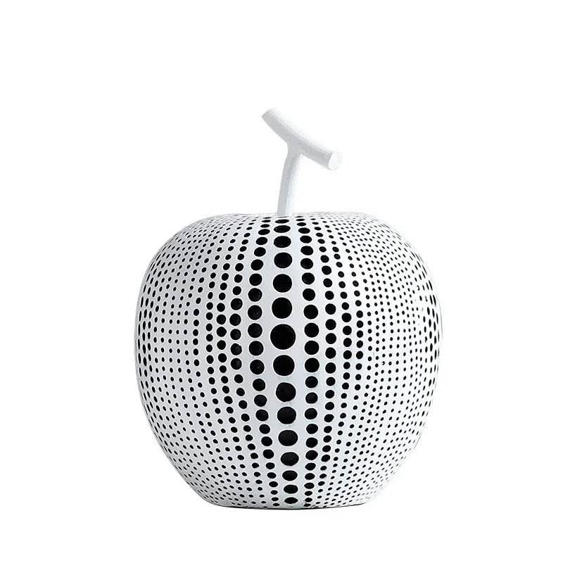 Decorative apple with black dot pattern on a white background