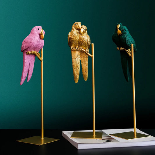 Couple parrot resin ornaments on gold stands in pink, gold and green colours, romantic love birds home decor