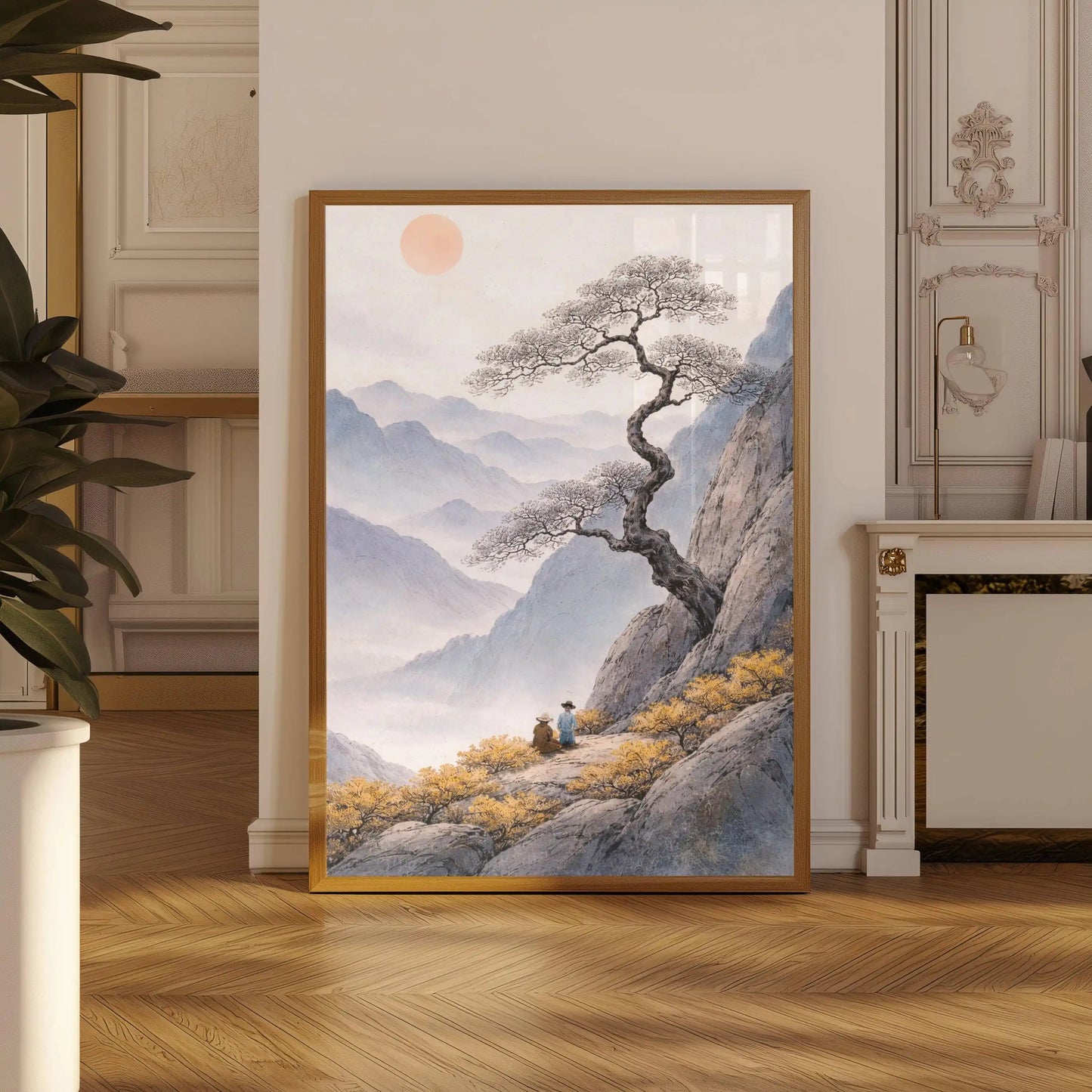 Framed artwork of a mountain landscape with a tree and two people in a room with decorative elements.
