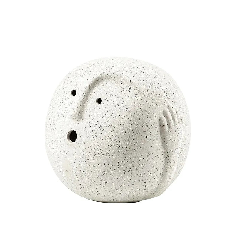 Abstract white ceramic face ornament close up