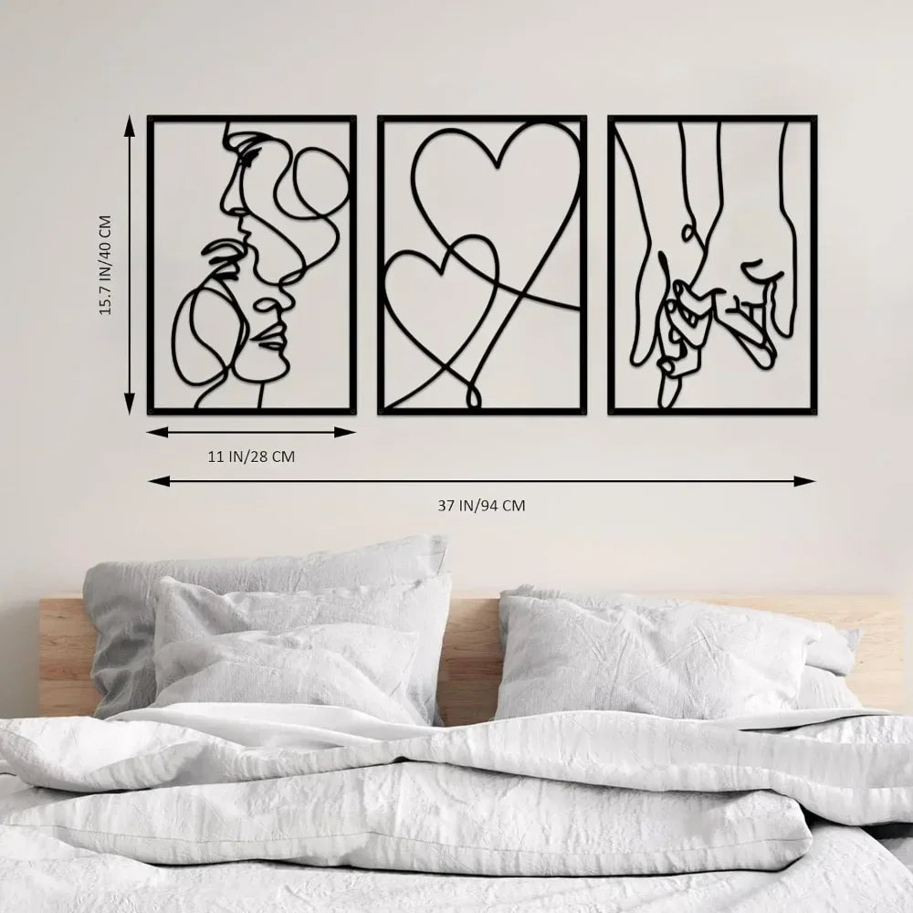 Three abstract metal wall art pieces on a wall above a bed with measurements indicated.