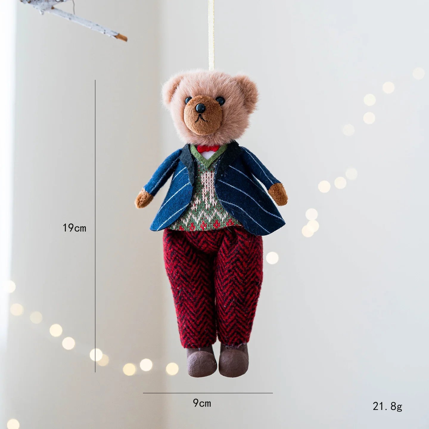 Teddy bear in a suit with measurements on a white background