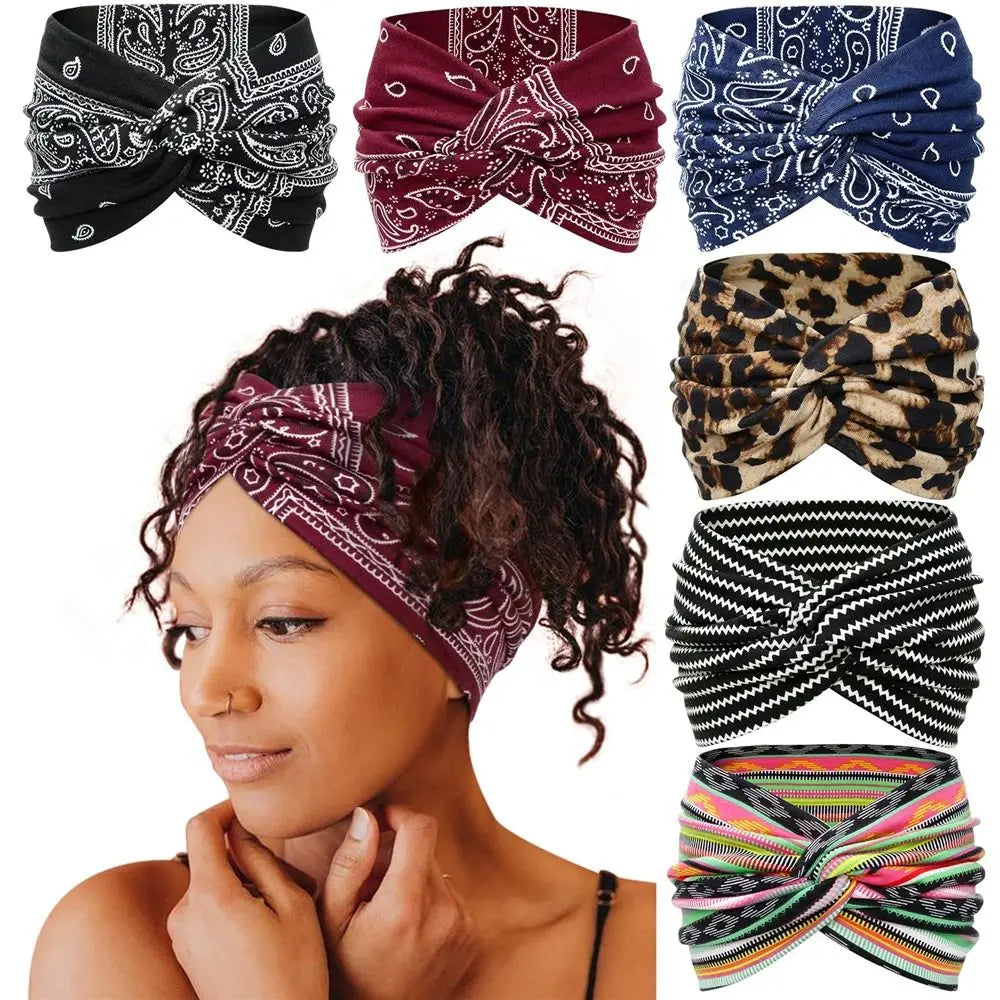 Woman wearing a purple bandana with various other bandanas displayed above her head.