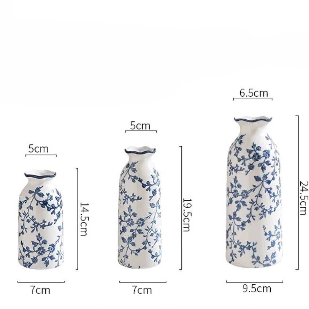 Set of three blue and white ceramic vases with measurements on a white background