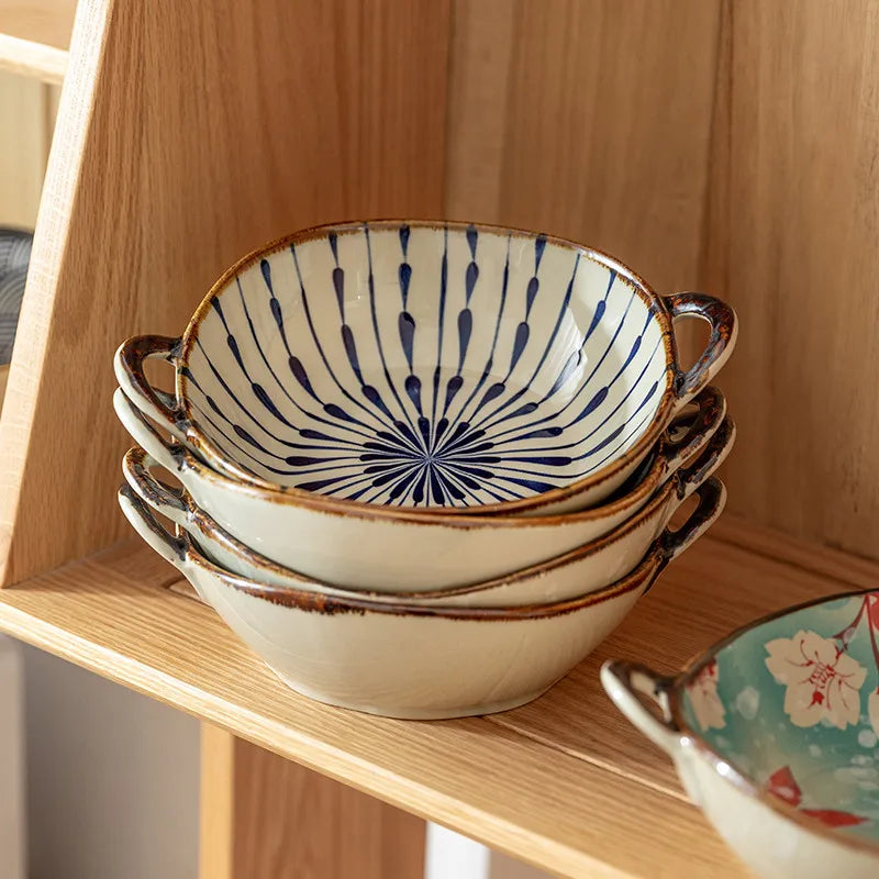 Stack of ceramic bowls with blue patterns on a wooden shelf