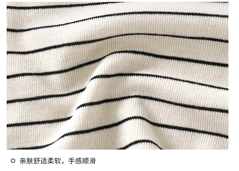 Close-up of striped fabric with black lines on a white background